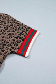 Brown leopard jacquard shirt with red, green, and white striped cuff detail.