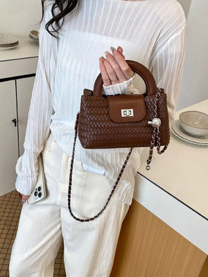 Brown crossbody bag featuring woven texture and woven
