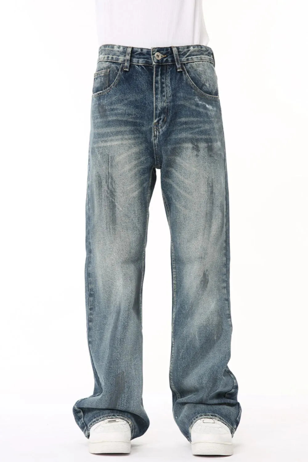 Baggy distressed denim flare jeans in medium wash, featuring a relaxed fit and casual style.
