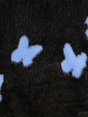 Black oversized knit sweater with light blue butterfly print detail