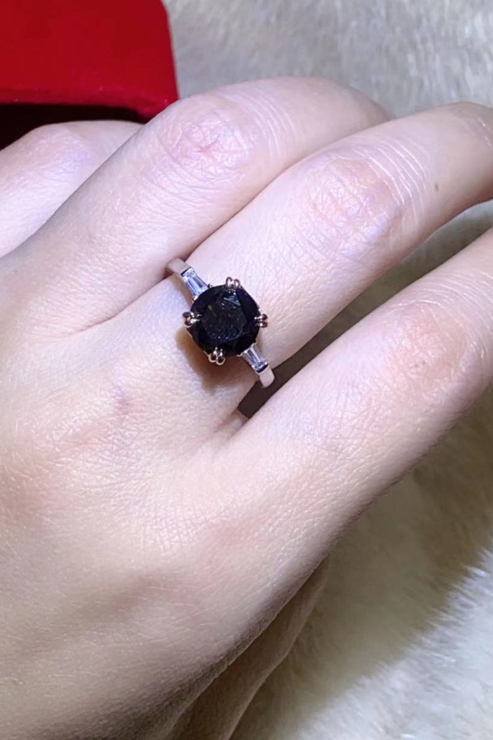 Black moissanite solitaire ring with baguette accents on sterling silver band