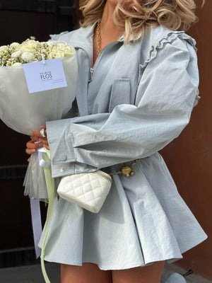 Light blue zip-up mini dress with lace frill collar, cinched waist, and quilted pouch accessory.