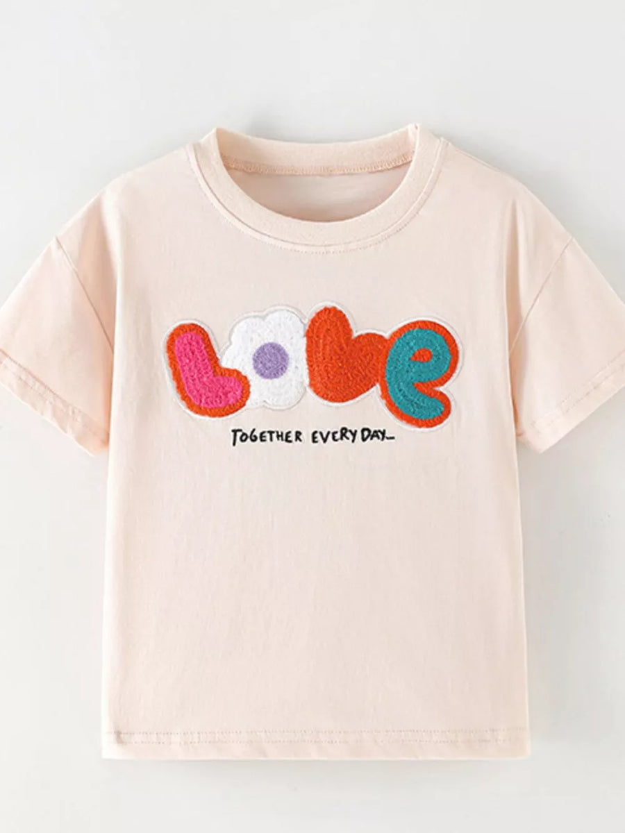 Toddler t-shirt in light pink cotton with colorful applique "love" graphic and text.