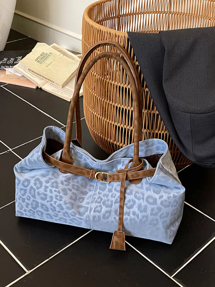 Blue leopard print PU leather shoulder bag with brown trim and buckle detail.