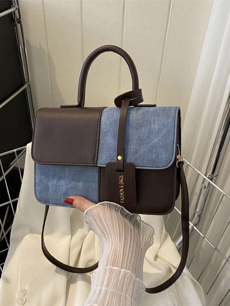 Chic two-tone PU leather handbag with denim accents and a brown top handle.