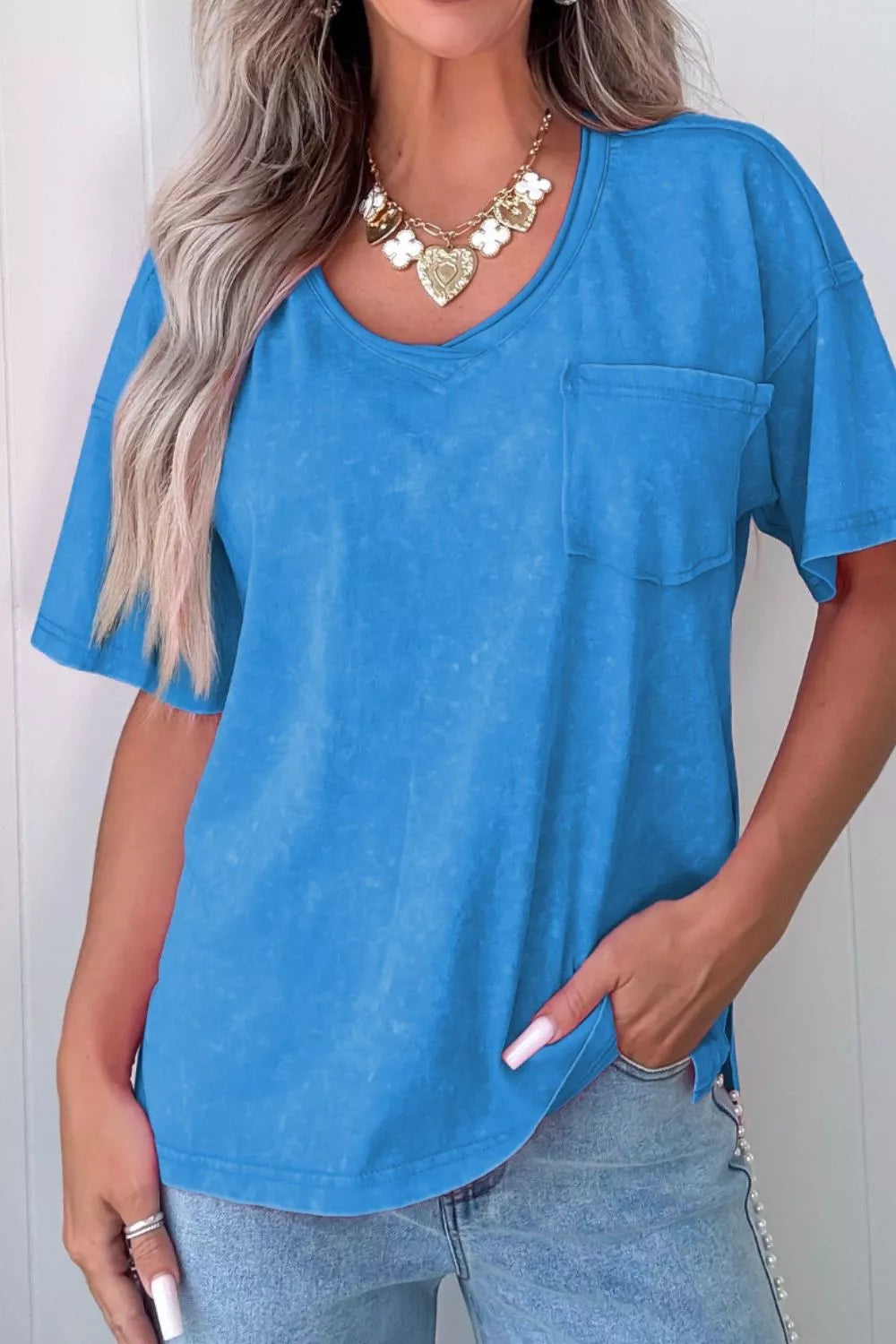 Blue cotton v-neck t-shirt with chest pocket and short sleeves