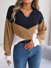 Chevron block knit polo sweater in camel, navy, and white acrylic with a V-neck.