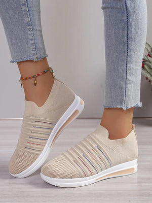 Striped knit slip-on wedge sneakers in light blue with rainbow stripe accents.