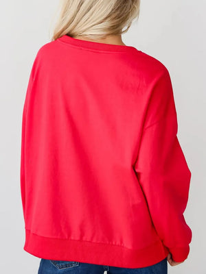 Red crewneck sweatshirt with embroidered Santa Baby graphic on front.