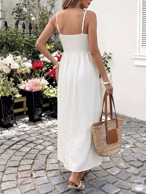 White smocked bodice maxi dress with spaghetti straps and cutout detail