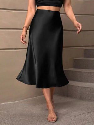 Black satin high-waisted midi skirt with a flowing A-line cut.