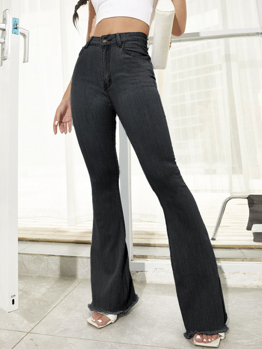 Black bootcut denim trousers with raw hem detail