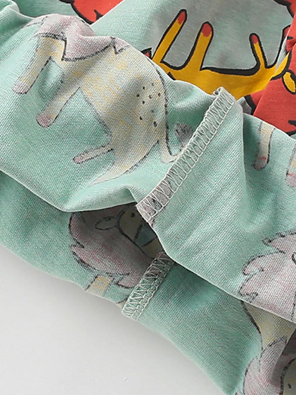 Toddler underwear set with lion graphic on mint green cotton blend fabric.
