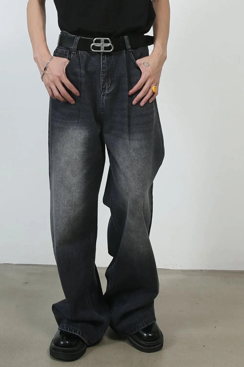 Black faded wash pleated palazzo jeans with a wide leg