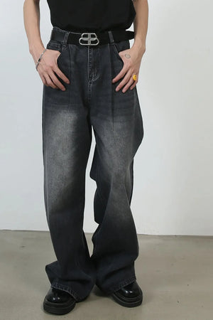Black faded wash pleated palazzo jeans with a wide leg