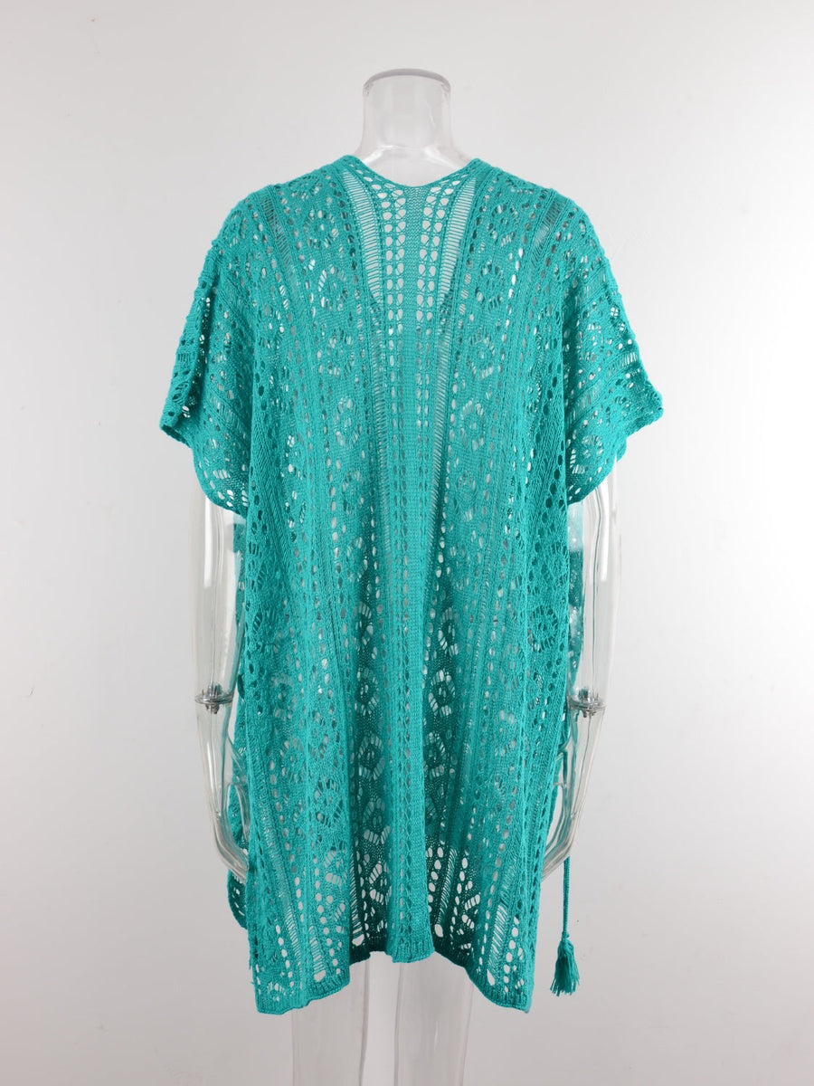 Teal open-knit V-neck beach cover-up with short sleeves and tassels.