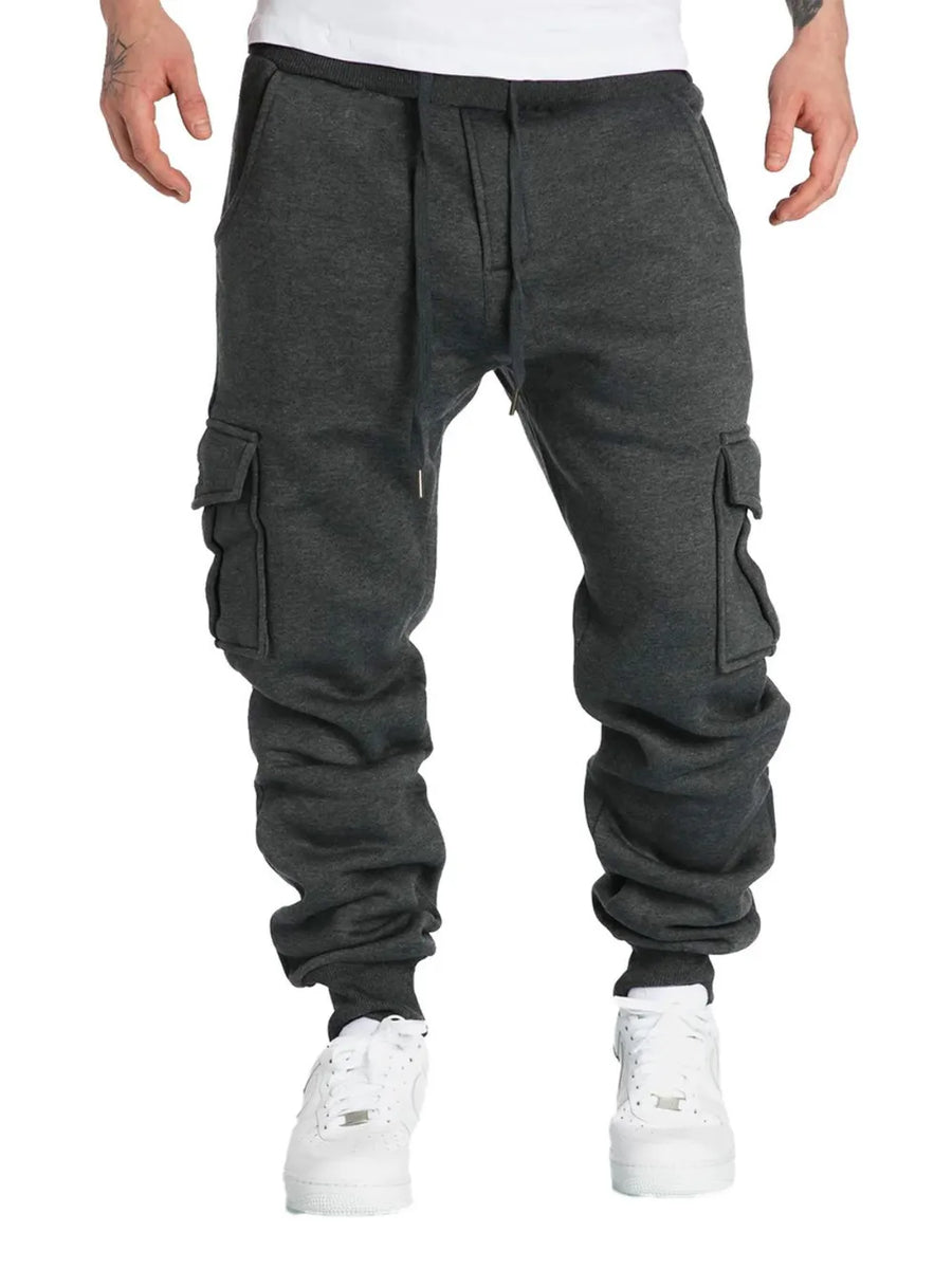 Dark gray cargo joggers with cuffed ankles and multiple pockets.