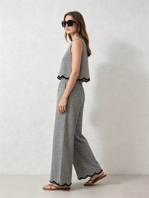 Plaid two-piece set with scalloped trim, featuring a sleeveless crop top and wide-leg pants.