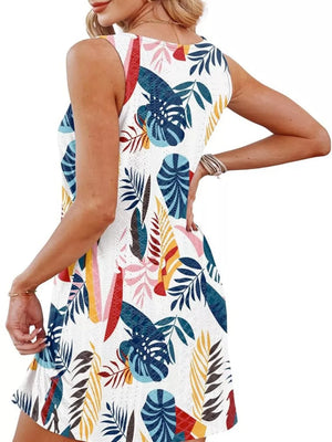 Eyelet tank dress with tropical leaf print and twisted hem detail.