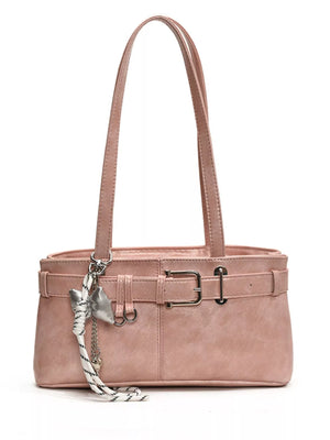 Blush pink shoulder bag with buckle detail and silver charm.