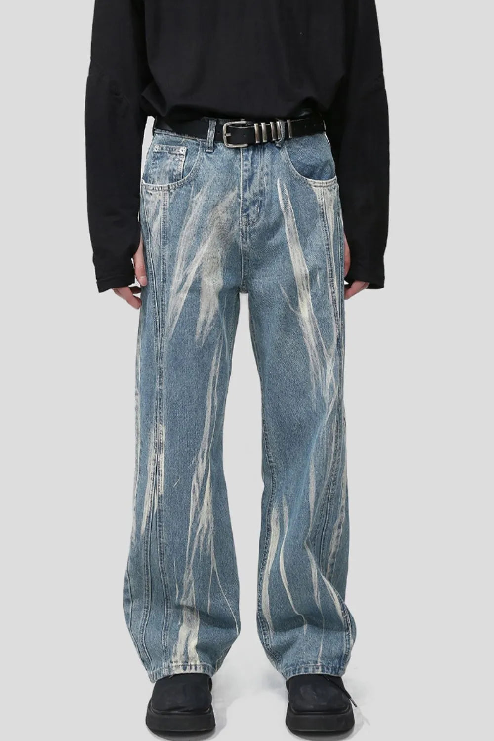 Bleached wash wide leg denim jeans with abstract white streaks and a casual fit.