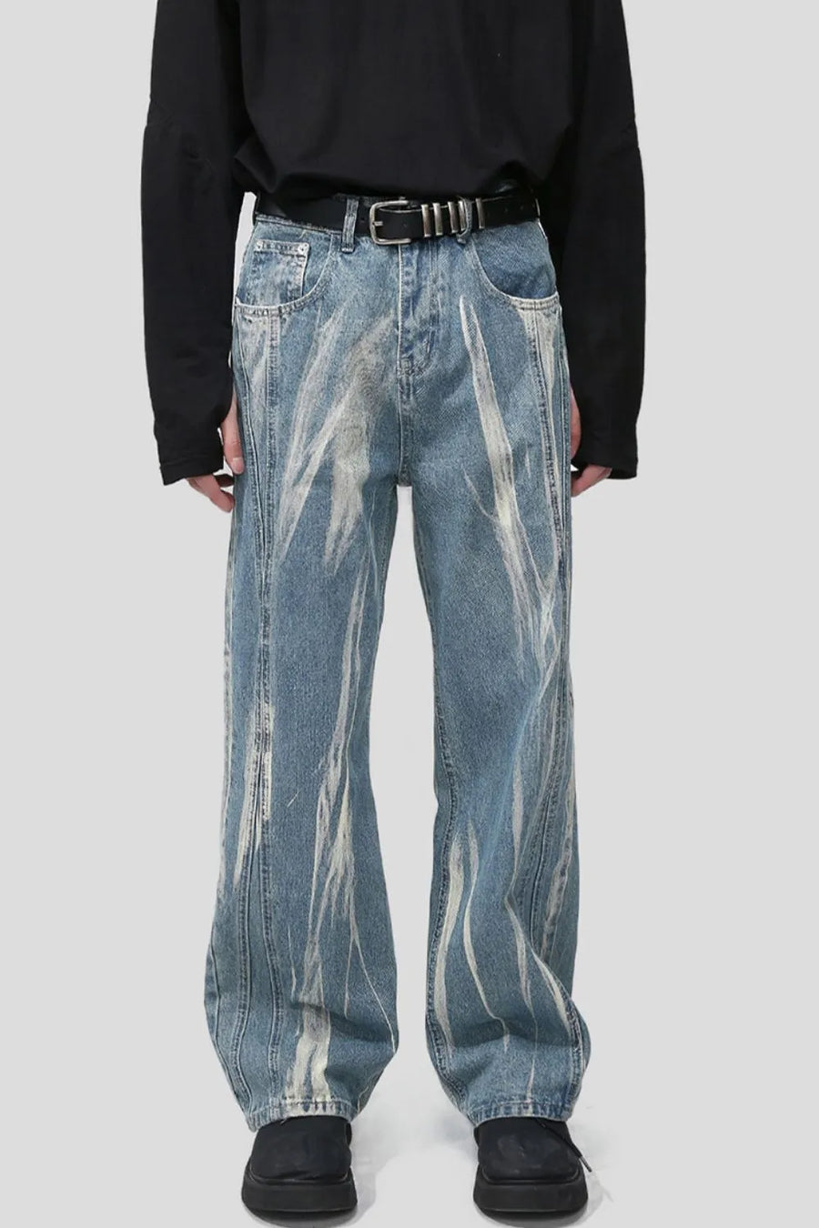 Bleached wash wide leg denim jeans with abstract white streaks and a casual fit.