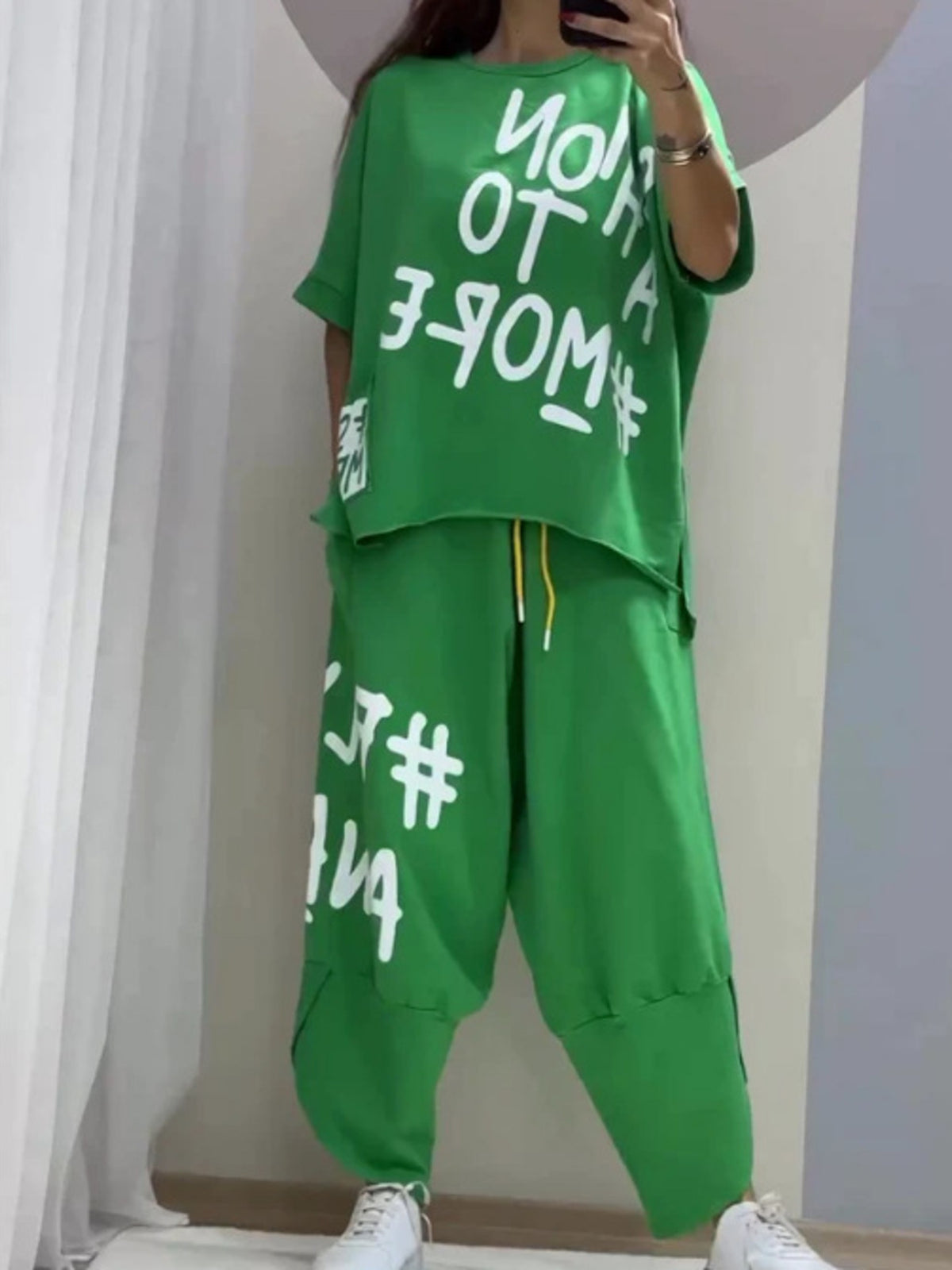 Green graphic tee and drawstring pants set with white text print