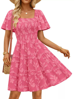 Smocked mini dress in Strawberry with tiered skirt, square neckline, and flutter sleeves.