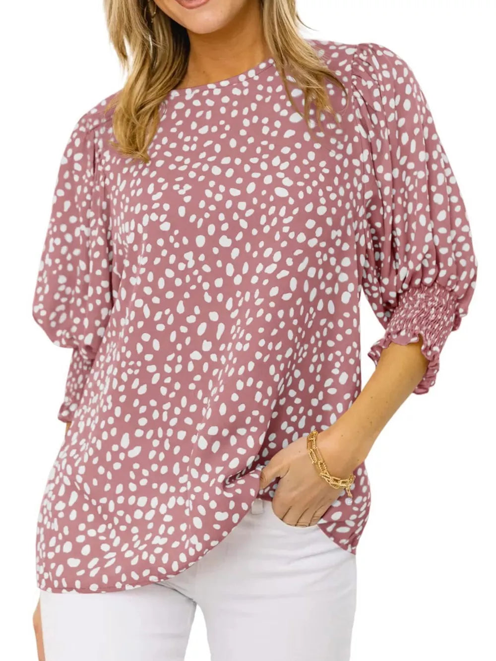 Pink animal print half sleeve blouse with smocked cuffs and puffed sleeves.