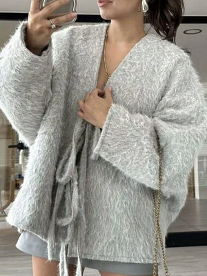 Textured knit tie-front cardigan in silver gray with wide sleeves and a fuzzy finish.