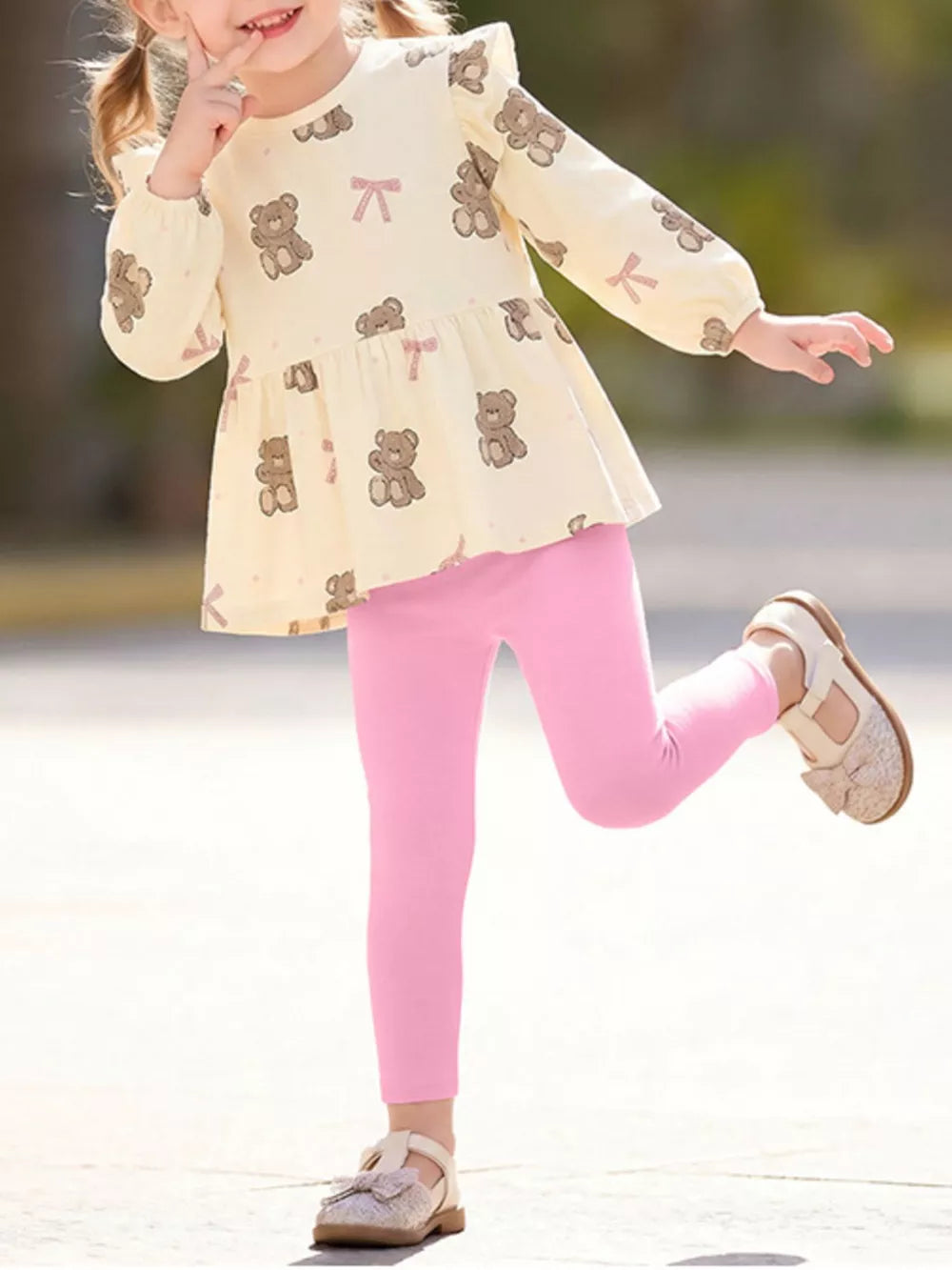 cream peplum top with bear print and round neck