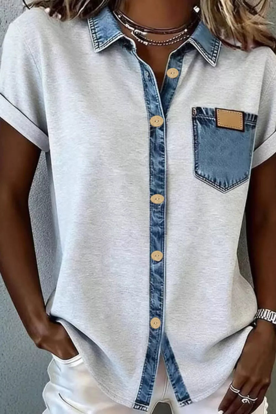 Light gray short sleeve button-down overshirt with denim collar and chest pocket.