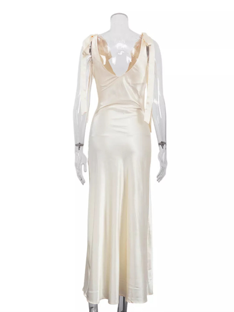 Cream satin maxi dress with tie shoulder straps and deep V-neckline