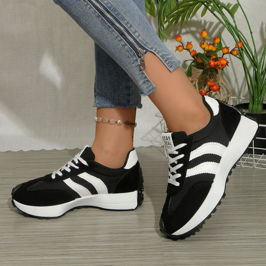 Black and white lace up round toe sneakers with chunky sole