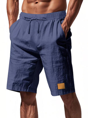 Men's navy blue chino shorts with drawstring waist and side pockets.