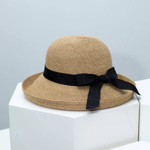 Straw sun hat with black ribbon detail and bow
