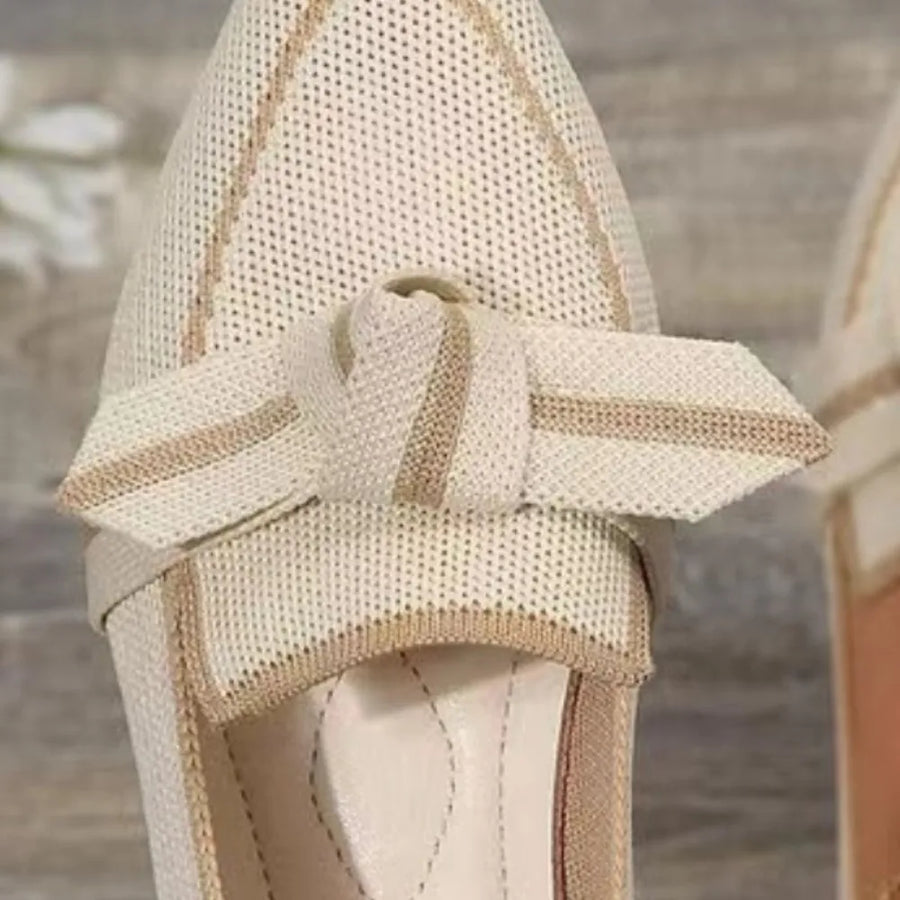 Knit bow loafers in ivory with contrast trim and bow detail.