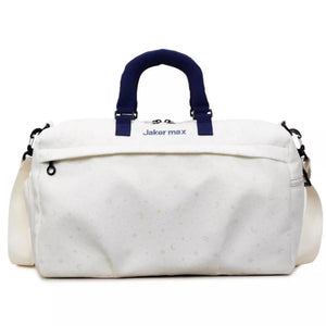 Cream white duffel bag with crescent moon and star pattern, navy handles and strap.