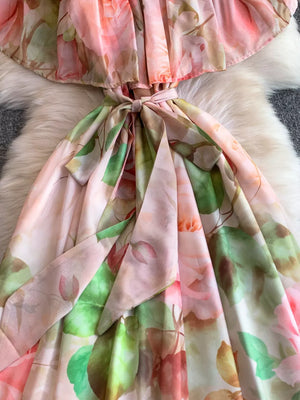 Botanical off-shoulder dress in light pink with a belted waist and floral print.
