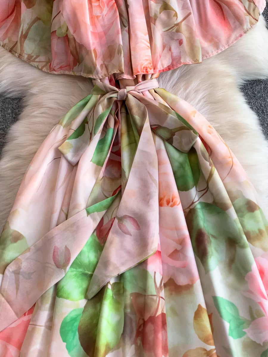 Botanical off-shoulder dress in light pink with a belted waist and floral print.