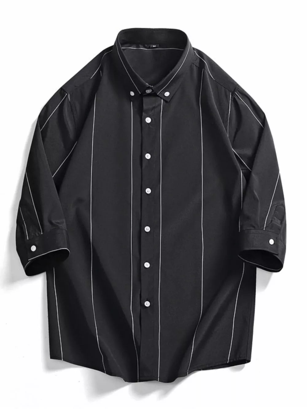 Black oversized cotton button-down shirt with white vertical pinstripes and white buttons.