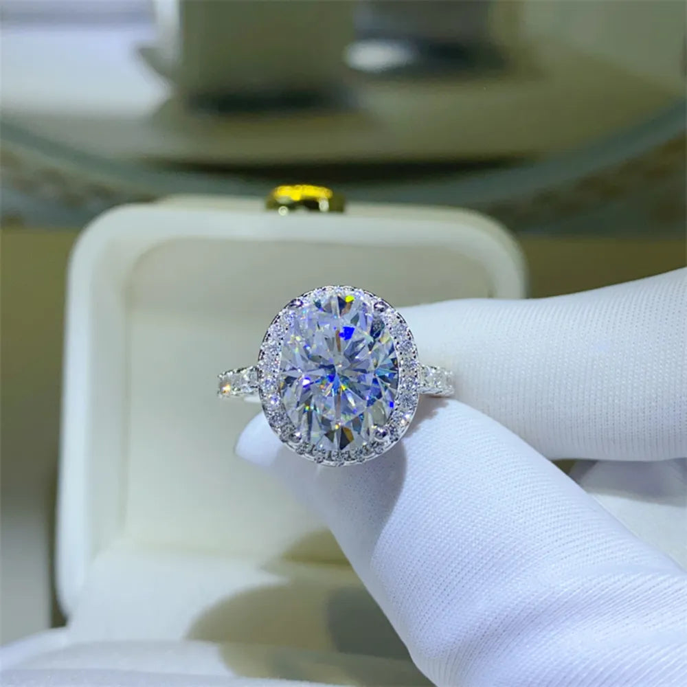 Oval halo moissanite engagement ring in silver with sparkling stones
