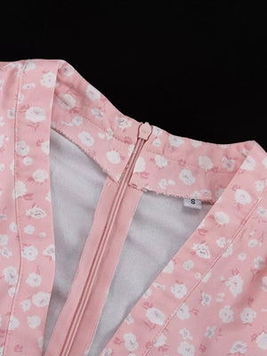 Pink floral print dress with V-neck and zipper closure