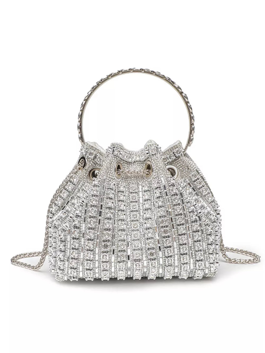 Silver rhinestone embellished mini crossbody bucket bag with chain strap and circular handle.