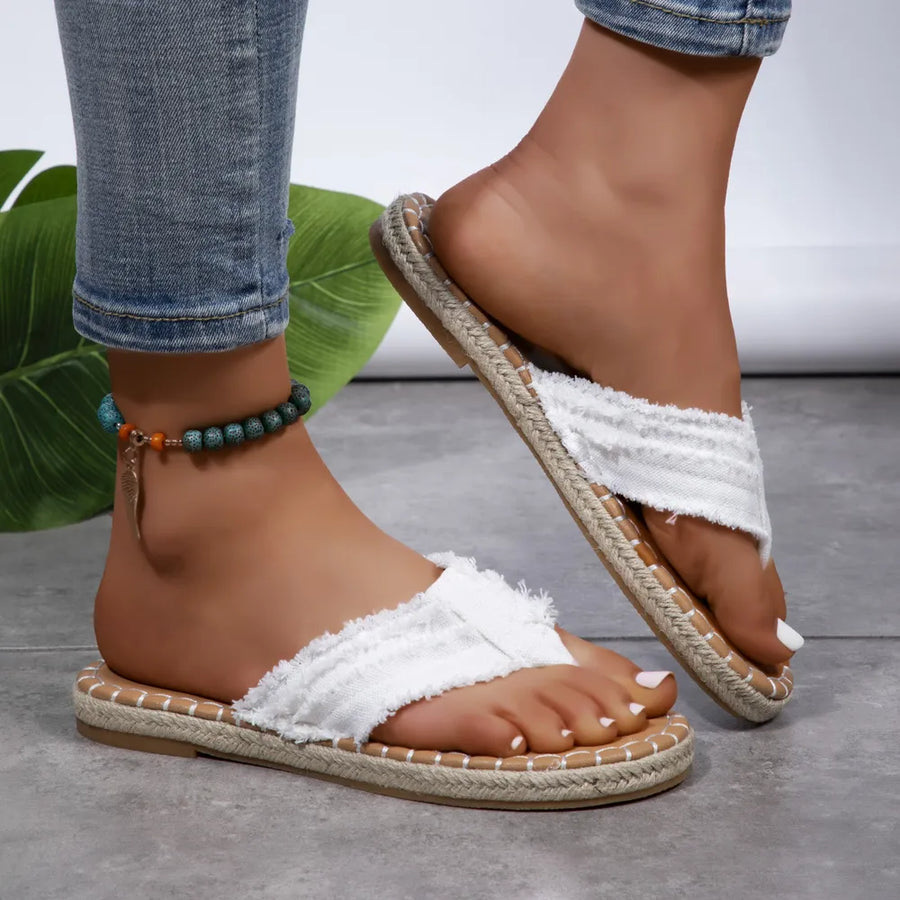 White frayed denim espadrille thong sandals with jute trim.