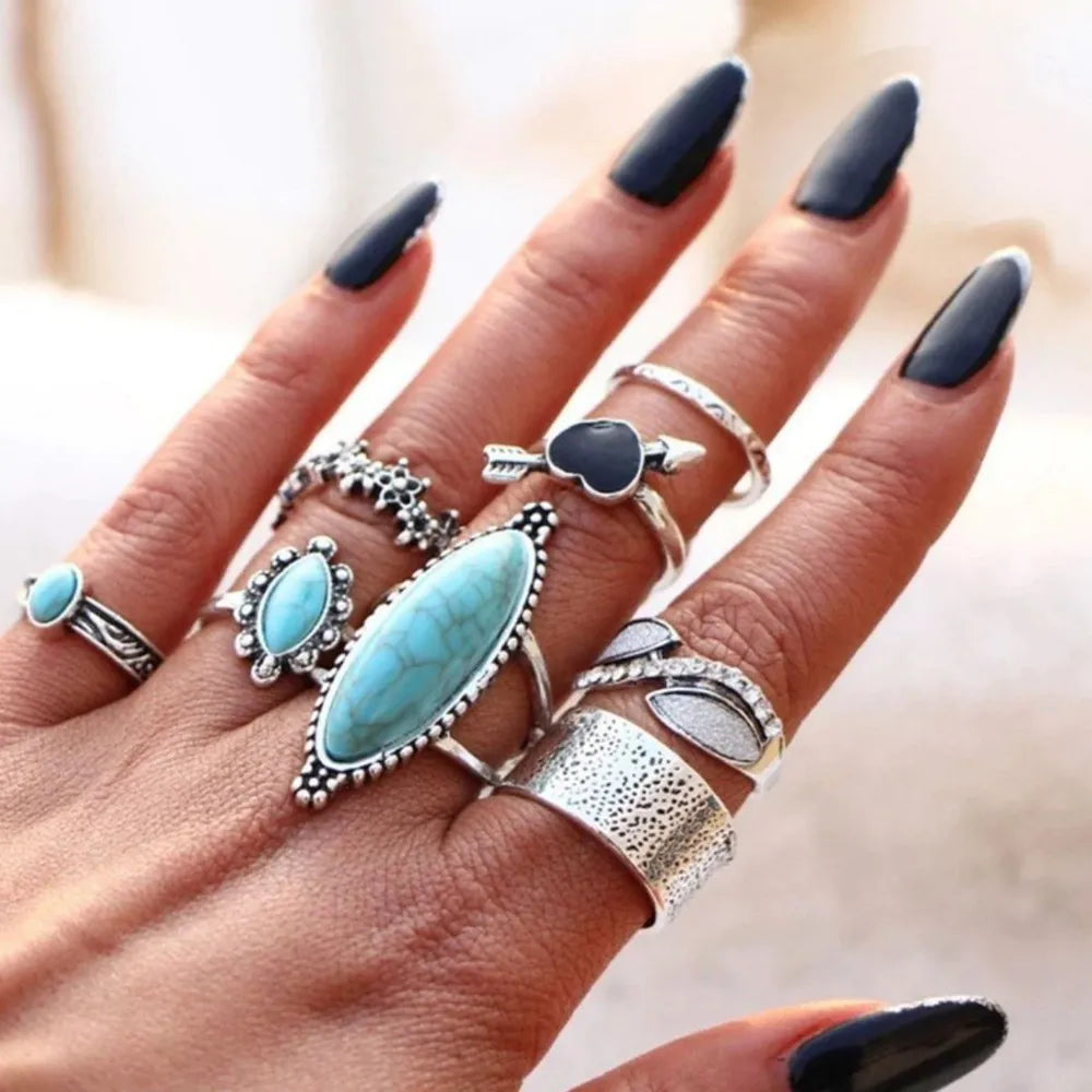 Bohemian silver ring set with assorted turquoise stones and designs.