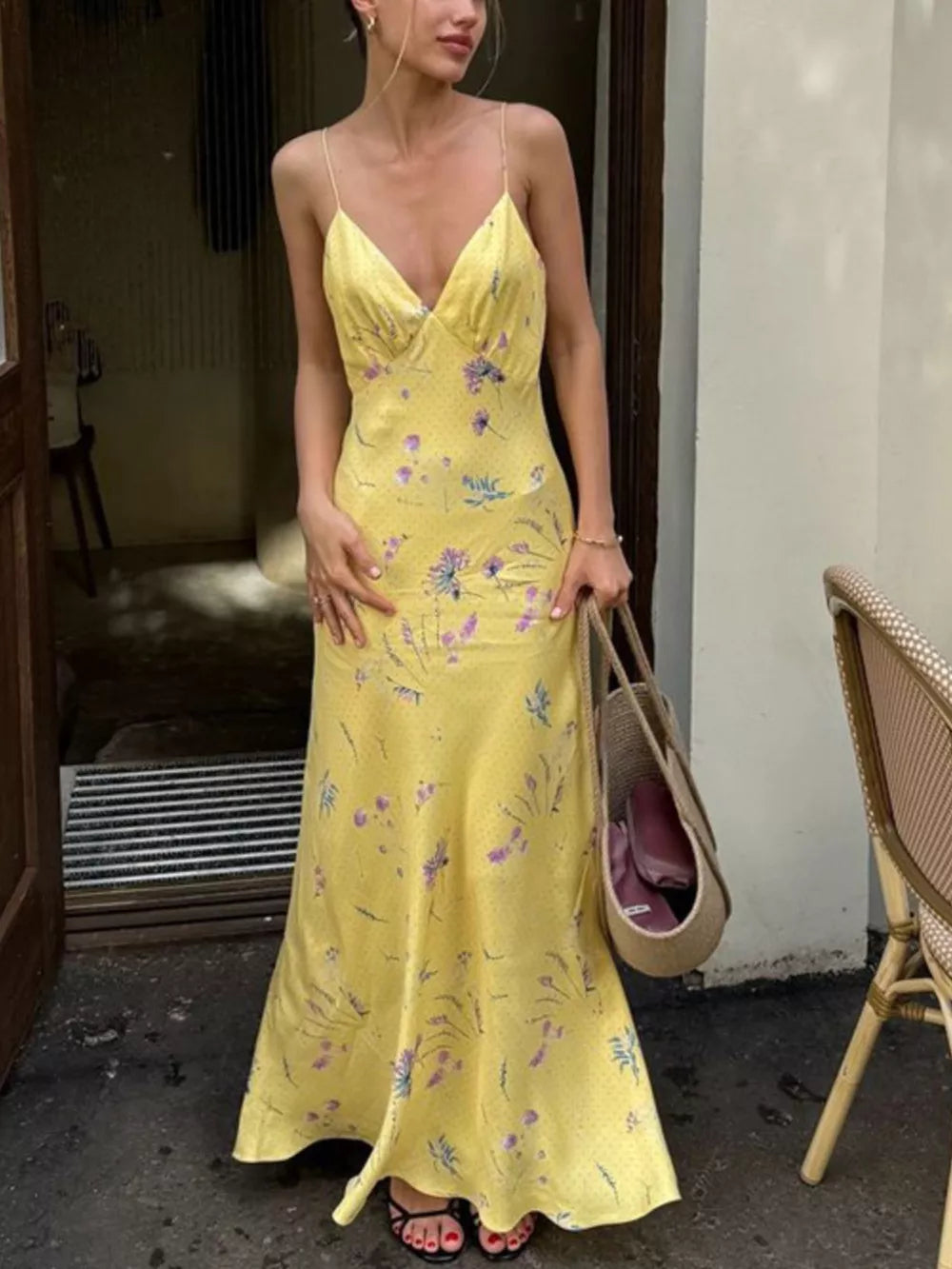 Yellow floral print slip dress with spaghetti straps and a V-neckline.