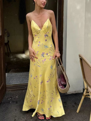 Yellow floral print slip dress with spaghetti straps and a V-neckline.