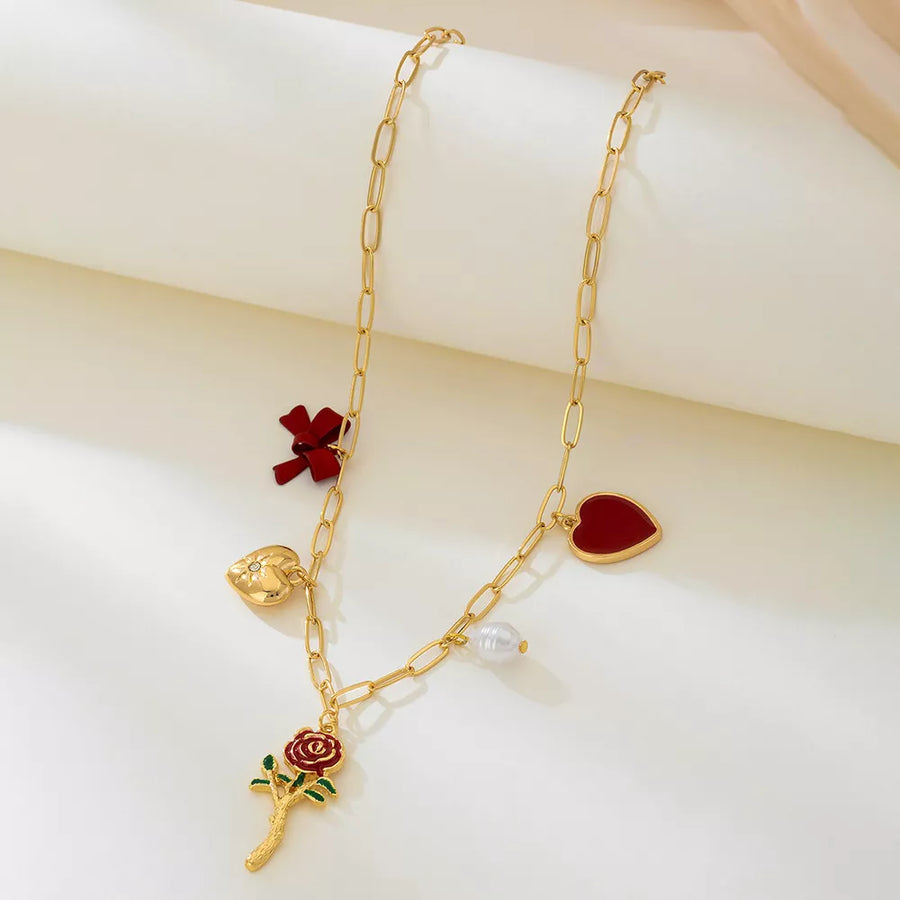 Synthetic Pearl, 18K Gold-Plated, Alloy, Resin Care instructions: Avoid wearing necklace in red with regular silhouette
