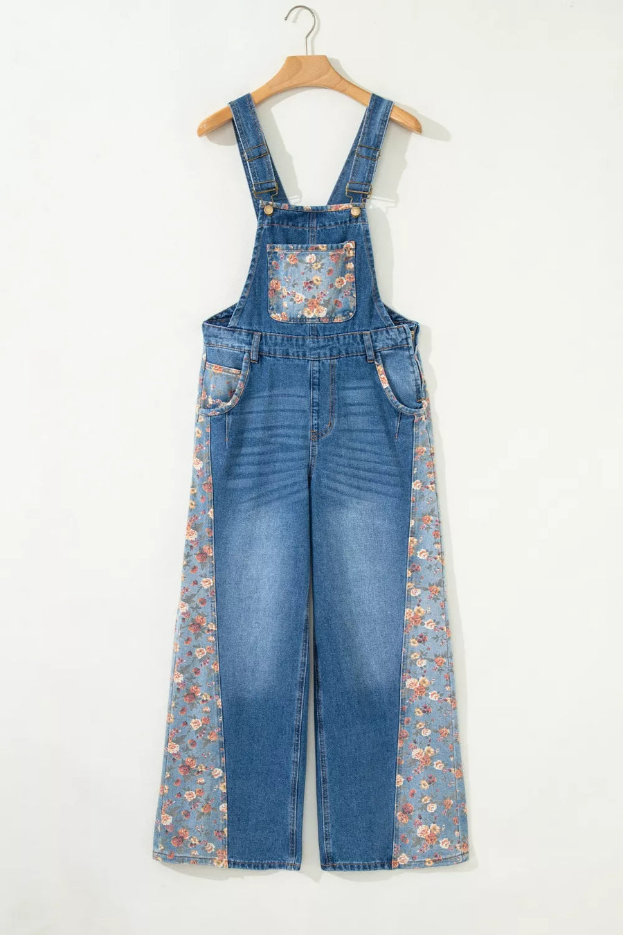 Denim overalls with vintage floral print panels on the bib and side seams.